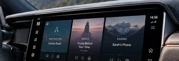 Range Rover dashboard with navigation, media and phone tiles on the centre screen