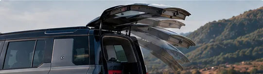 Defender powered tail door opening
