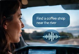 Driver asking a voice assistant to find a coffee shop near the river